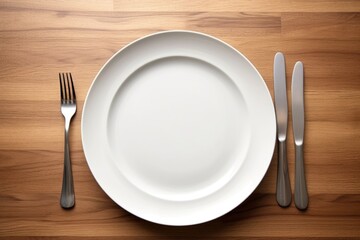 an empty plate with cutlery placed neatly beside