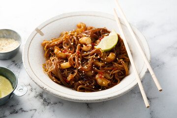 Traditional noodles with shrimps and lime