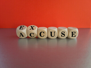 Accuse and excuse symbol. Turned cubes and changes the word accuse to excuse. Beautiful grey table...