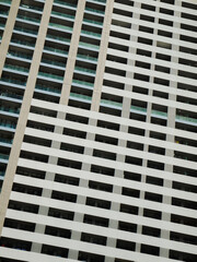 Modern skyscraper mirrored facade background.