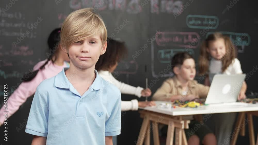 Poster the young boy at coding and programming classroom at school