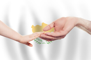 Cyprus baby and parent hands on the background of flag of Cyprus Help, aid, support, charity concept