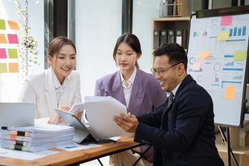 Asian business people working as a good team in the office. Successful teamwork in a meeting, workplace concept.