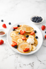 Homemade pancakes with banana and berries