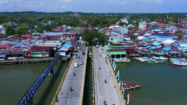 Aerial View Of Cars And Motorcycles Driving Through Jembatan Dua Manggar Bridge In Balikpapan Timur, Indonesia.