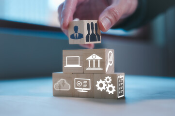 Hand select human icon put on top of pyramid of wooden block. Human Resource Management. Leadership. New leader or new employees to team, project management, business and investment