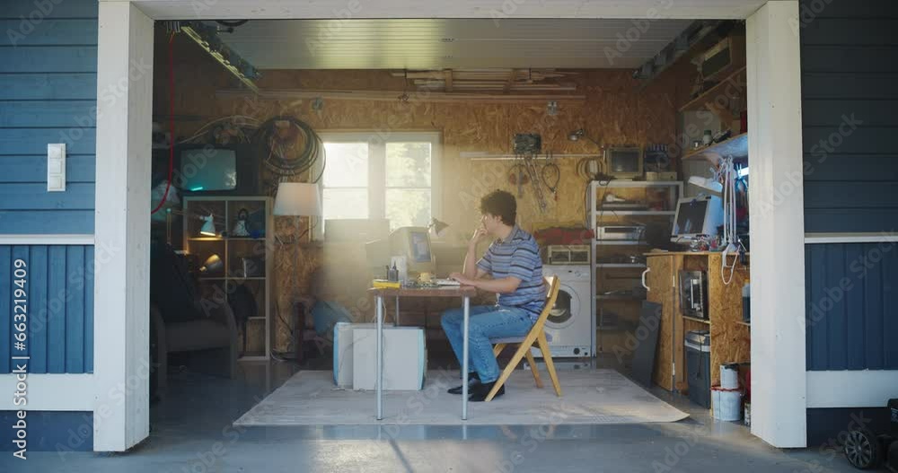 Poster Caucasian Male Software Engineer Programming On Old Desktop Computer In Retro Garage With Random Appliances. Man Working On Innovative Online Service Startup Company In Nineties. Nostalgia Concept.