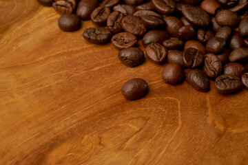Black coffee and coffee beans on Wooden table