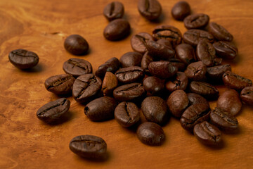 Black coffee and coffee beans on Wooden table