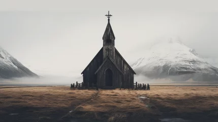Foto op Canvas Isolated wooden church against snow-covered mountains, enveloped in mist, with golden grass foreground in a serene landscape. © Gregory O'Brien