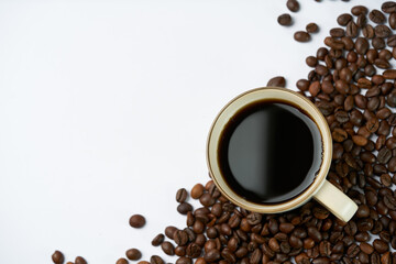 Black coffee and coffee beans on white background