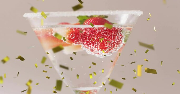 Animation of confetti falling and cocktail on white background