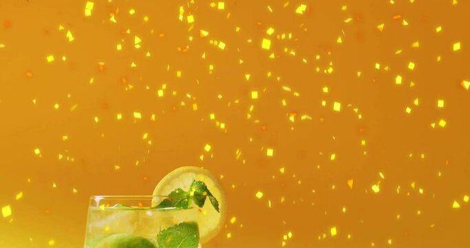 Animation of confetti falling and cocktail on yellow background