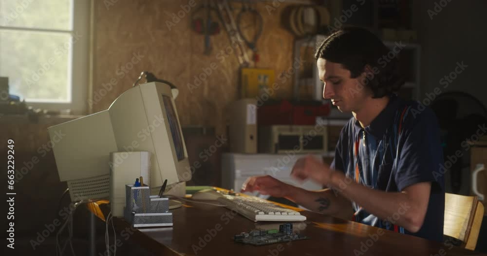 Aufkleber caucasian male software engineer programming on old desktop computer in retro garage with random app