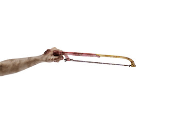 The hand of a scary zombie with blood and wounds carrying a saw