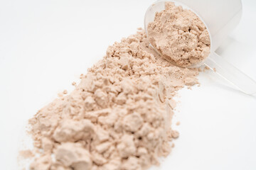 scoop of protein powder isolated on white 
