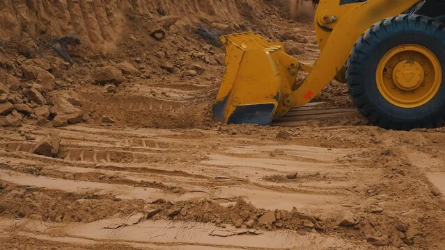 Excavator digging a quarry. Industrial construction. Preparing the area for construction
