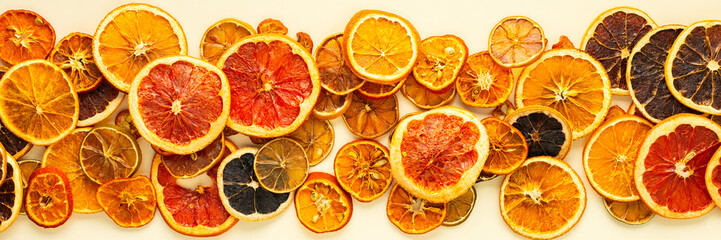 Banner of dried citrus, fruits sliced orange and tangerine, lime and lemon, kumquat and grapefruit slices , preparation for the celebration of Christmas, copy space