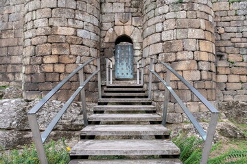 Stairs, door and facade with stone shield. Castle of the Counts of Ribadavia, Ourense, Galicia.