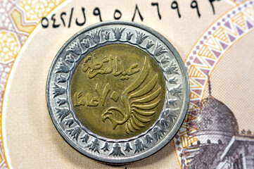 Obverse side of Egyptian 1 LE EGP One Egyptian pound coin on Egyptian banknote, Translation of...