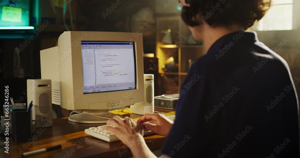 Aufkleber back view of caucasian male software engineer programming on old desktop computer in retro garage. f