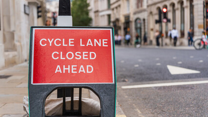 Cycle lane closed sign on busy London street