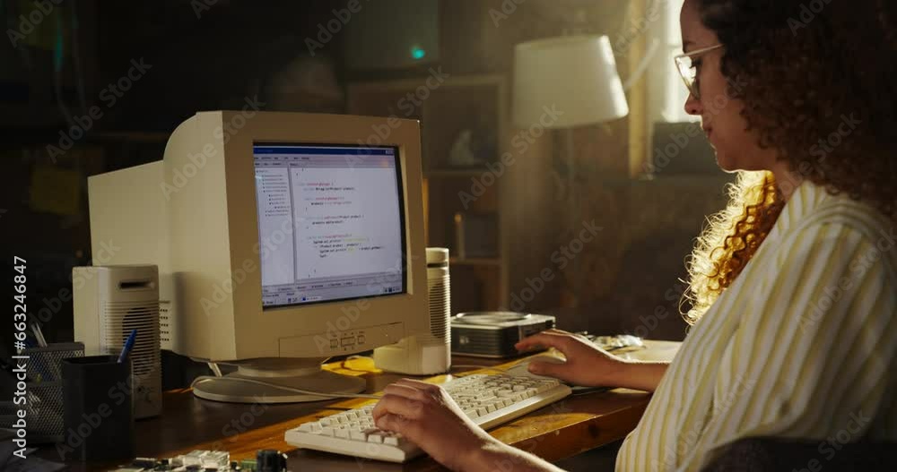 Poster Side View Of Hispanic Female Software Engineer Programming on Old Desktop Computer In Retro Garage. Focused Woman Starting Tech Startup Company In Nineties. Coding Innovative Online Service At Home.