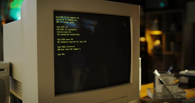 Close Up Shot Of Old Desktop Computer On Work Desk Of Software Developer In Retro Garage. Dated PC Has Operating System Terminal Opened, Prompts Running On Screen, Code Functioning Successfully.
