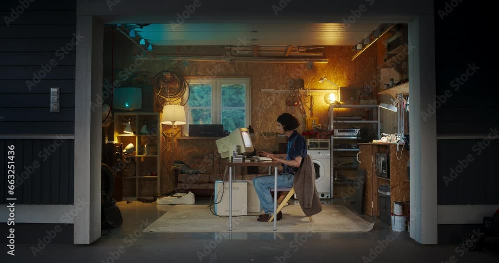 Poster Caucasian Male Software Engineer Programming On Old Desktop Computer In Retro Garage In The Evening. Ambitious Man Starting an Innovative Fintech Startup Company In Nineties. Nostalgia Concept.