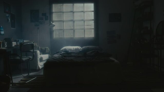 Interior No People Shot Of Dark Bedroom With Blinded Window, Unmade Bed, Desk And Chair During Night