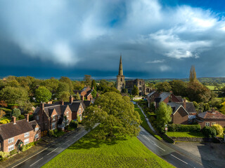 Old oak tree and St Mary’s Church in Astbury, Cheshire