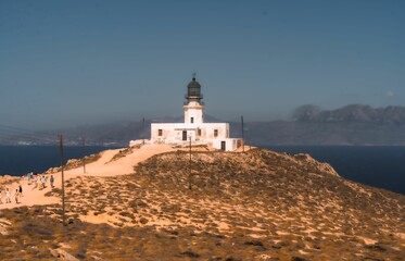 Fototapeta na wymiar Breathtaking view of Armenistis lighthouse located on the picturesque Mykonos island in Greece