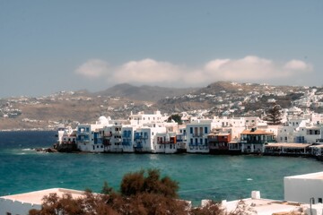 Fototapeta na wymiar Aerial view of the beautiful cityscape of Mykonos, Greece with stunning shoreline buildings
