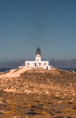 Fototapeta na wymiar Breathtaking view of Armenistis lighthouse located on the picturesque Mykonos island in Greece