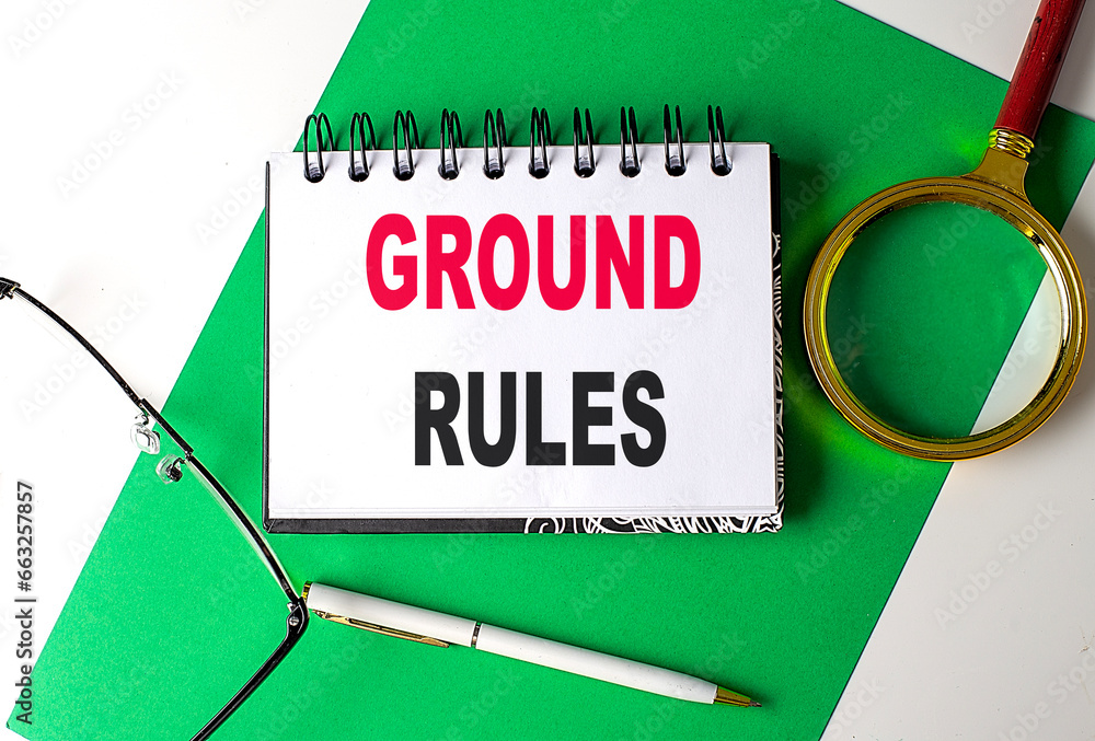 Poster ground rules text on notebook on green paper