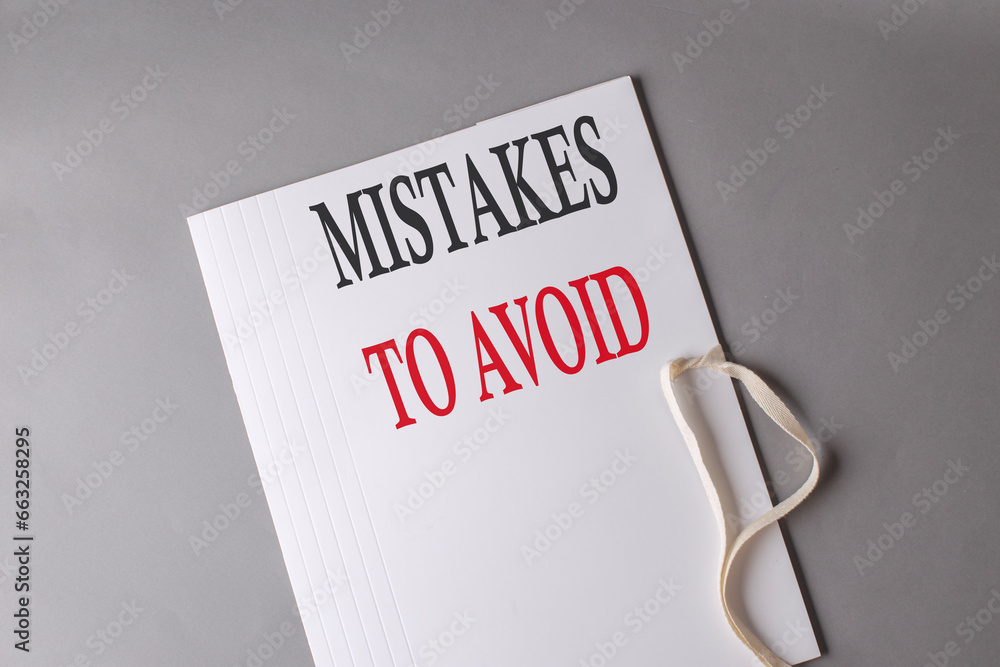 Poster mistakes to avoid text on white folder on grey background