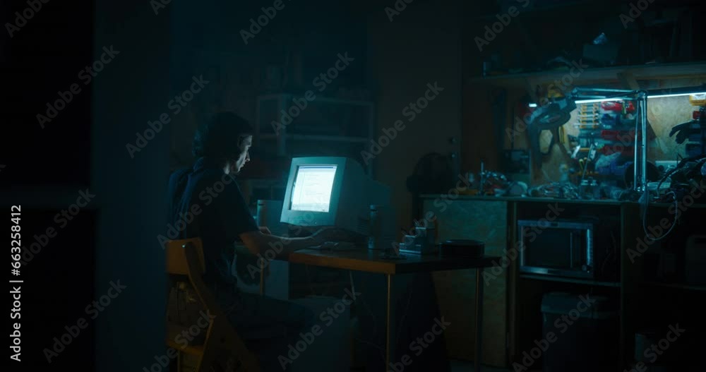 Poster Caucasian Male Programmer Using Old Desktop Computer In Retro Garage Late At Night. White Hat Hacker Searching For Software Vulnerabilities, Coding Cyber Security System, Protecting Data In Nineties.