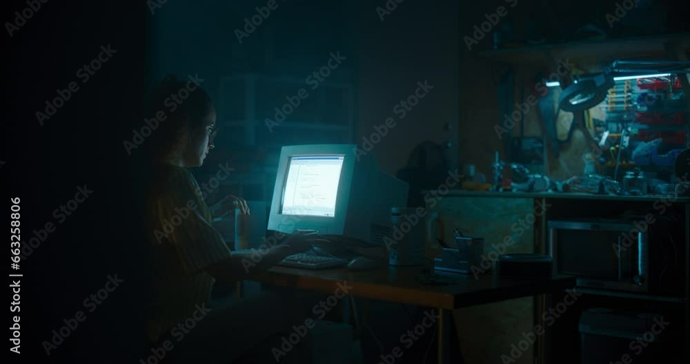 Poster Hispanic Female Programmer Using Old Desktop Computer In Retro Garage Late At Night. Evil Hacker Searching For Software Vulnerabilities, Doing DDOS Attack, Coding Trojan Horse Programs, Stealing Data.