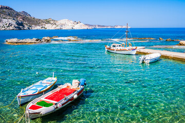 Fototapeta na wymiar Fishing boats in small harbor of Mandrakia village, Milos island, Cyclades, Greece