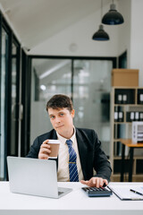 Mature businessman executive manager looking at laptop watching online webinar training or having virtual meeting video conference doing market research working in office..