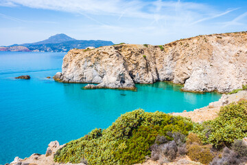 View of beautiful rocky coast near Tsigrado beach and azure sea water, Milos island, Cyclades, Greece