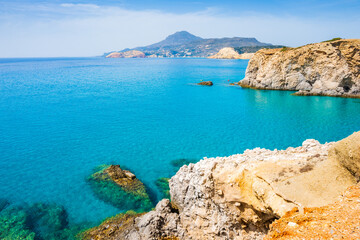 Obraz premium View of beautiful rocky coast near Tsigrado beach and azure sea water, Milos island, Cyclades, Greece