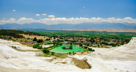 Landscape Panorama of a beautiful lake in bottom of Cotton castle. Famous Pamukkale and Hierapolis - Cotton Castle without the crowd © Aloshin Evgeniy