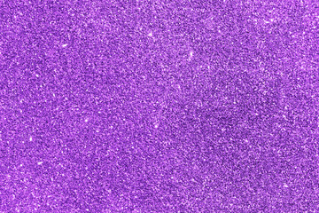 Purple violet glitter sparkle background for New year, Christmas and celebration.  Light bright texture backdrop. 