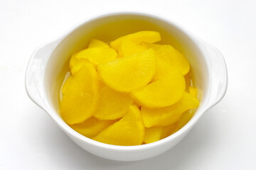 Sweet and tart slices of yellow pickled daikon, known as takuan in Japan and danmuji in Korea.