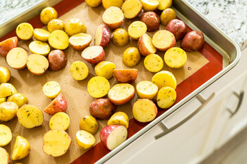 Roasting Halved Mixed Marble Potatoes in Modern Kitchen