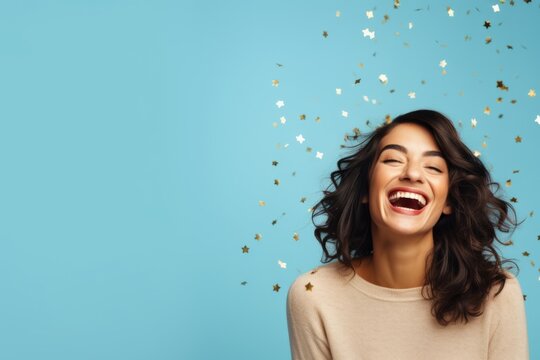 amazed surprising greeting cheerful young adult smiling laug happiness female woman emjoy big exited celebrate with confetti papershoot studio shot on color background portrait shooting