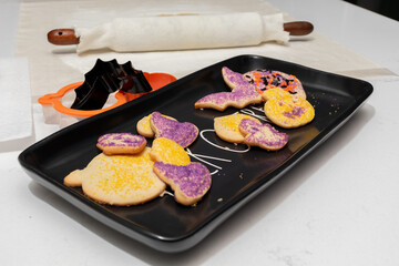 Closeup of Halloween Cookies and Baking Implements in Kitchen, horizontal