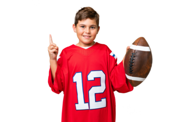Little caucasian kid playing rugby over isolated chroma key background pointing up a great idea