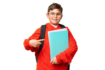 Little caucasian student kid over isolated chroma key background pointing to the side to present a...